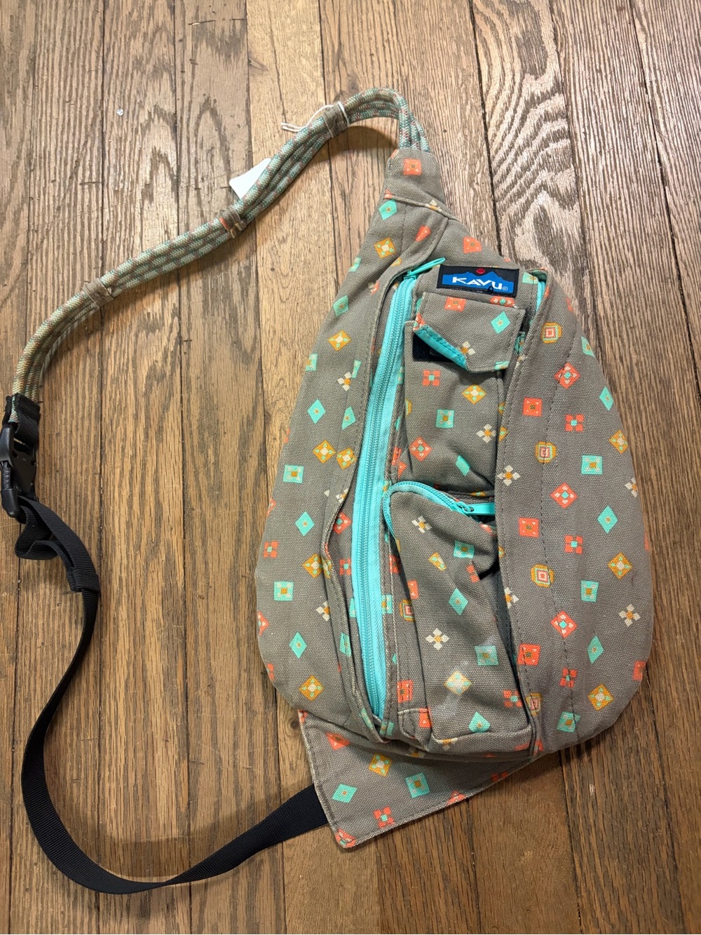 Kavu Sling Bag with Turquoise and Coral Accents
